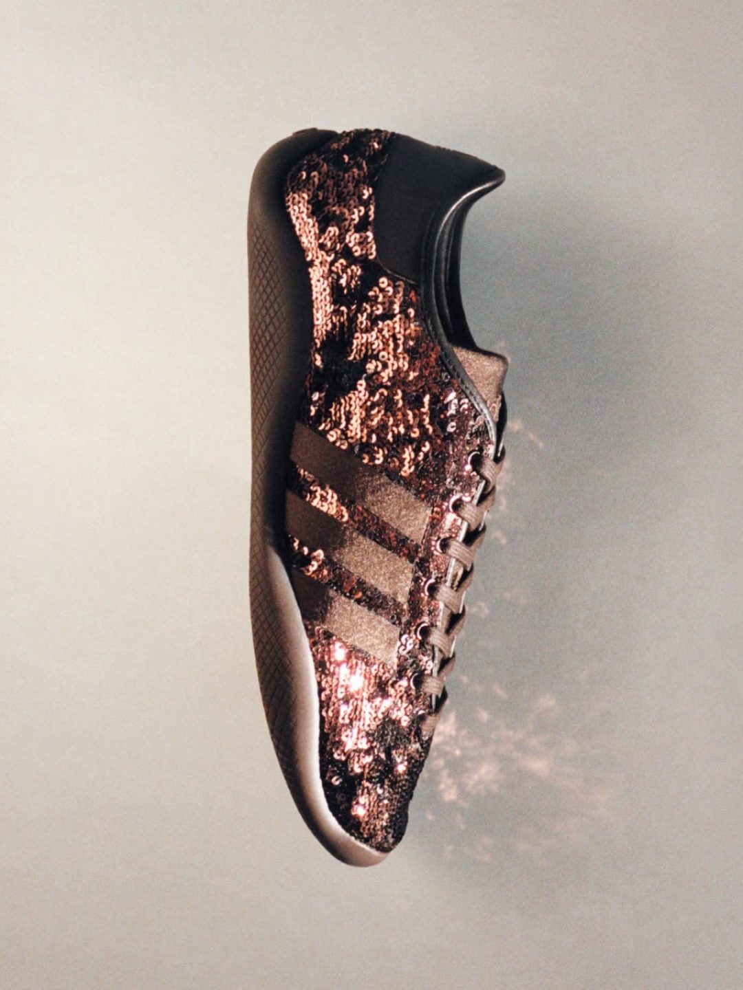 Guided by LightThe new Wales Bonner Karintha Lo in brown sequin, leather and satin.adidas Origin